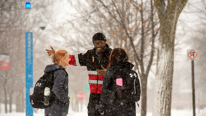 St. Cloud State University patrol officer talking with St. Cloud State students